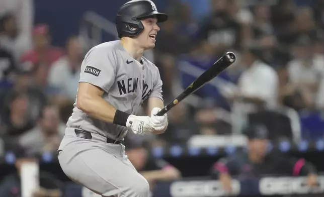 New York Yankees' Ben Rice hits a double in the fifth inning of a baseball game against the Miami Marlins, Saturday, Aug. 2, 2025, in Miami. (AP Photo/Jim Rassol)