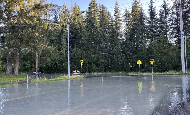 This image provided by the City and Borough of Juneau shows flooding from a release of water and snowmelt at Mendenhall Glacier covered some roads and threatened homes along the Mendenhall River in Juneau, Alaska on Wednesday, Aug. 13, 2025. (City and Borough of Juneau via AP)