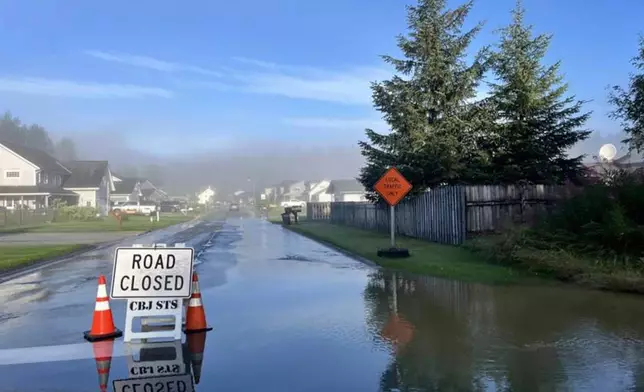 This image provided by the City and Borough of Juneau shows flooding from a release of water and snowmelt at Mendenhall Glacier covered some roads and threatened homes along the Mendenhall River in Juneau, Alaska on Wednesday, Aug. 13, 2025. (City and Borough of Juneau via AP)