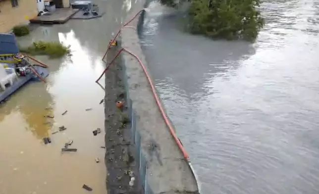 This drone image provided by the City and Borough of Juneau shows flooding from a release of water and snowmelt at Mendenhall Glacier covered some roads and threatened homes along the Mendenhall River in Juneau, Alaska on Wednesday, Aug. 13, 2025. (City and Borough of Juneau via AP)