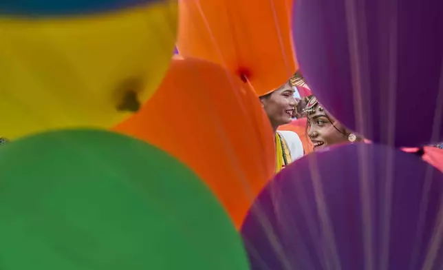 Participants get ready to take part in the Pride Parade in Kathmandu, Nepal, Sunday, Aug. 10, 2025. (AP Photo/Niranjan Shrestha)
