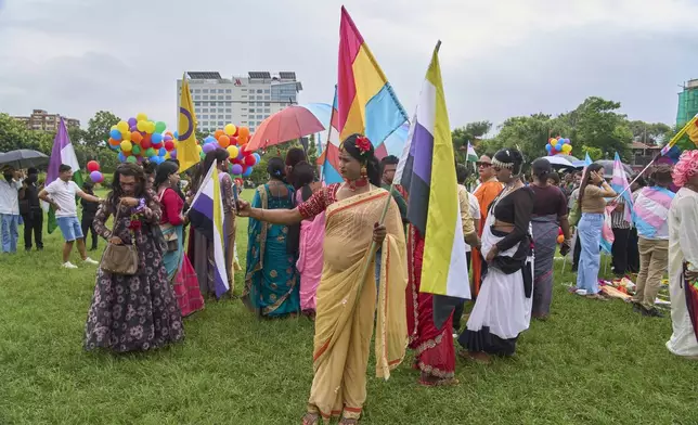 Participants get ready to take part in the Pride Parade in Kathmandu, Nepal, Sunday, Aug. 10, 2025. (AP Photo/Niranjan Shrestha)