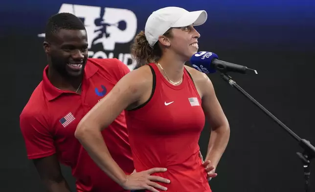 FILE - United States' Frances Tiafoe, left, jokes with teammate Madison Keys during an interview on court following Keys' win over Marie Bouzkova of the Czech Republic in their Group C match at the United Cup tennis event in Sydney, Australia, Thursday, Dec. 29, 2022. (AP Photo/Mark Baker, File)