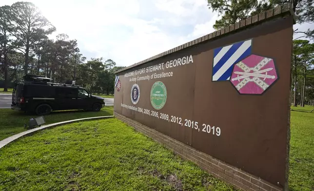 A sign welcoming people to Fort Stewart in Georgia is seen on Wednesday, Aug. 6, 2025. (AP Photo/Mike Stewart)