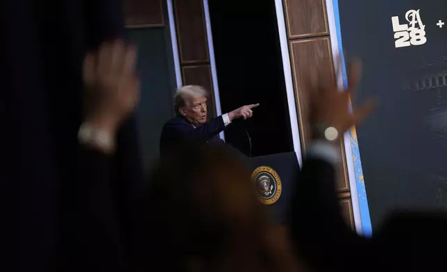 President Donald Trump answers questions from reporters after signing an executive order about the 2028 Los Angeles Olympic Games, in the South Court Auditorium of the Eisenhower Executive Office Building on the White House campus, Tuesday, Aug. 5, 2025, in Washington. (AP Photo/Julia Demaree Nikhinson)