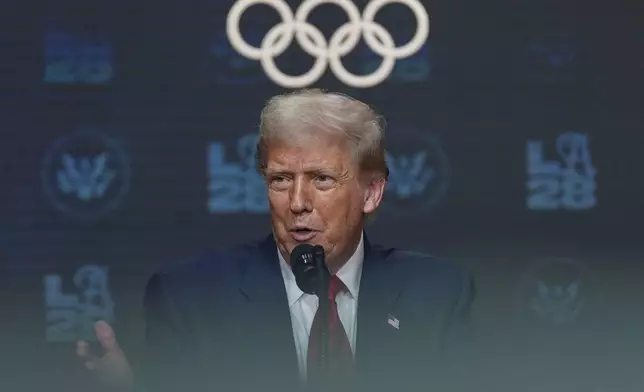 President Donald Trump answers questions from reporters after signing an executive order about the 2028 Los Angeles Olympic Games, in the South Court Auditorium of the Eisenhower Executive Office Building on the White House campus, Tuesday, Aug. 5, 2025, in Washington. (AP Photo/Julia Demaree Nikhinson)