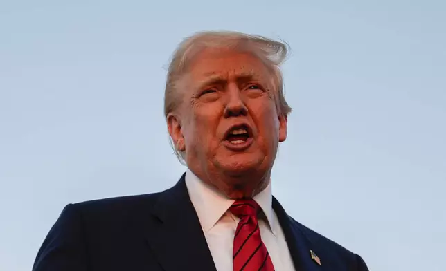 President Donald Trump speaks with reporters before boarding Air Force One at Lehigh Valley International Airport, Sunday, Aug. 3, 2025, in Allentown, Pa. (AP Photo/Julia Demaree Nikhinson)