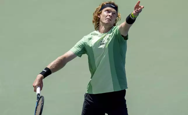 Andrey Rublev, of Russia, tosses the ball to serve to Lorenzo Sonego, of Italy, during the National Bank Open men’s tennis tournament, Friday, Aug. 1, 2025, in Toronto. (Frank Gunn/The Canadian Press via AP)