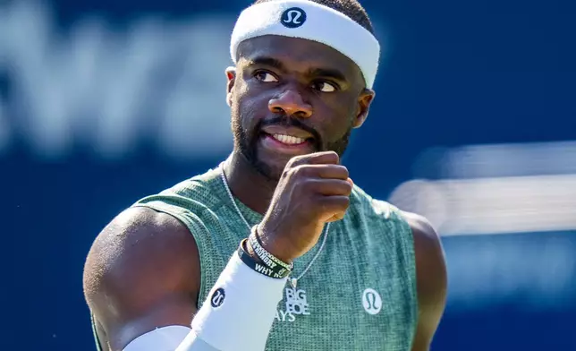 Frances Tiafoe, of the United States, celebrates winning a game against Aleksandar Vukic, of Australia, during the National Bank Open men’s tennis tournament, Friday, Aug. 1, 2025, in Toronto. (Frank Gunn/The Canadian Press via AP)