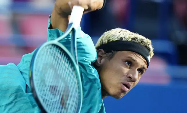 Gabriel Diallo, of Canada, serves to Taylor Fritz, of the United States, during their match at the National Bank Open men's tennis tournament in Toronto, Friday, Aug. 1, 2025. (Frank Gunn/The Canadian Press via AP)