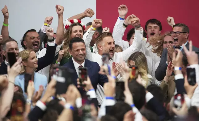 FILE - Presidential candidate Rafal Trzaskowski, a liberal pro-European Union figure, center, arrives at his headquarters after the presidential election runoff in Warsaw, Poland, Sunday, June 1, 2025. (AP Photo/Petr David Josek, File)