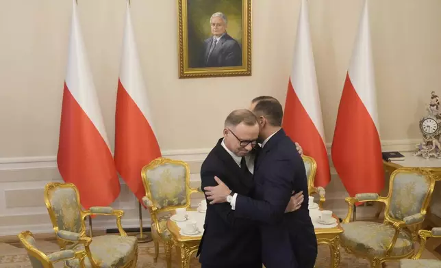 FILE - Poland's outgoing President Andrzej Duda, left, welcomes the President Elect Karol Nawrocki at the Presidential Palace in Warsaw, Poland, Tuesday, June 3, 2025. (AP Photo/Czarek Sokolowski, File)