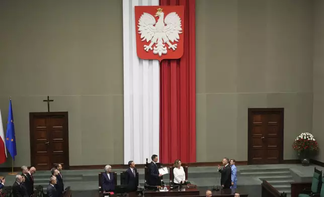 Poland's new president Karol Nawrocki takes the oath during the inauguration ceremony in Warsaw, Poland, Wednesday, Aug. 6, 2025. (AP Photo/Czarek Sokolowski)