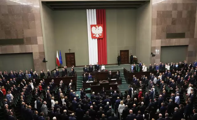 Poland's new president Karol Nawrocki with his wife Marta Nawrocka attends his inauguration ceremony in Warsaw, Poland, Wednesday, Aug. 6, 2025. (AP Photo/Czarek Sokolowski)