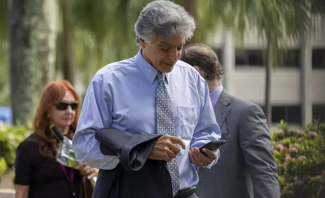 Former FBI agent Mark Rossini arrives at the federal courthouse in San Juan, Puerto Rico, Wednesday, Aug. 27, 2025. (AP Photo/Alejandro Granadillo)