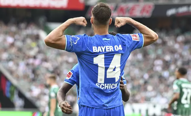 Leverkusen's Patrik Schick celebrates after scoring his side's third goal during the German Bundesliga soccer match between Werder Bremen and Bayer 04 Leverkusen in Bremen, Germany, Saturday, Aug. 30, 2025. (Carmen Jaspersen/dpa via AP)