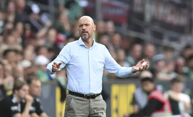 Leverkusen's head coach Erik ten Hag gestures during the German Bundesliga soccer match between Werder Bremen and Bayer 04 Leverkusen in Bremen, Germany, Saturday, Aug. 30, 2025. (Carmen Jaspersen/dpa via AP)