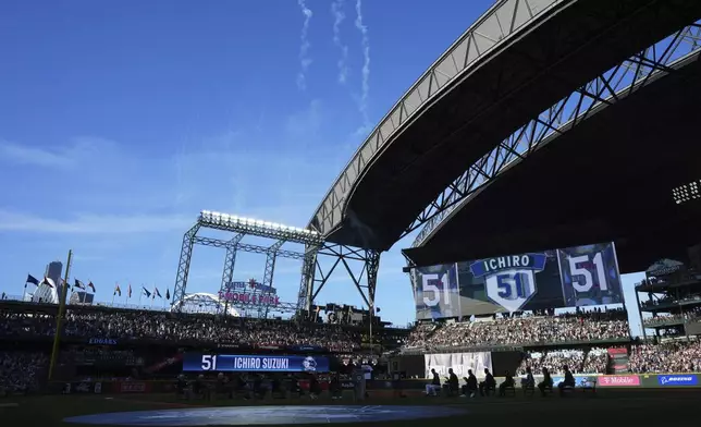 Fireworks go off for former Seattle Mariners right fielder Ichiro Suzuki during his jersey retirement ceremony on Saturday, Aug. 9, 2025, before a baseball game between the Mariners and the Tampa Bay Rays in Seattle. (AP Photo/Lindsey Wasson)