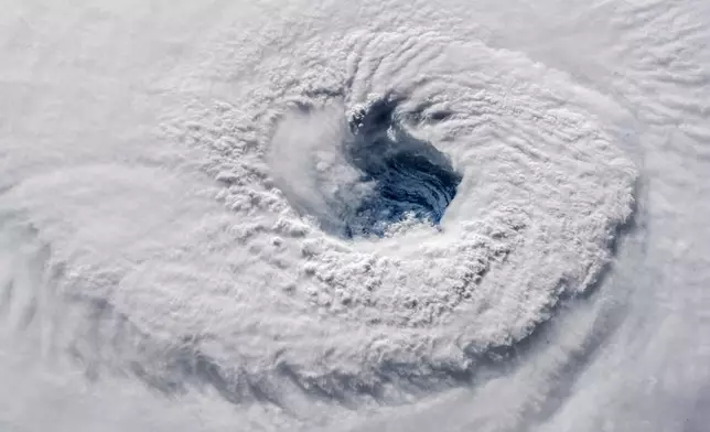 FILE - In this Sept. 12, 2018 photo provided by NASA, Hurricane Florence churns over the Atlantic Ocean heading for the U.S. east coast as seen from the International Space Station. (Alexander Gerst/ESA/NASA via AP,File)
