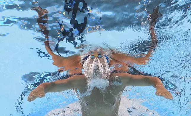 Pedro Pinotes of Angola competes in the men's 200-meter breaststroke heat at the World Aquatics Championships in Singapore, Thursday, July 31, 2025. (AP Photo/Lee Jin-man)
