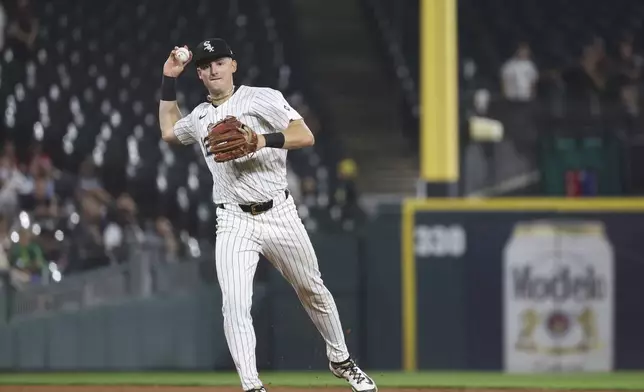 Chicago White Sox shortstop Colson Montgomery (12) throws to first base against the Detroit Tigers in a baseball game, Tuesday, Aug. 12, 2025, in Chicago. (AP Photo/Talia Sprague)