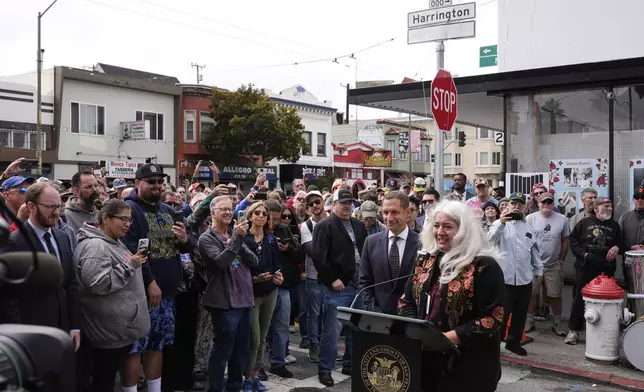 Trixie Garcia, daughter of musician Jerry Garcia, speaks during a ceremony to unveil the naming of Jerry Garcia Street, in honor of the Grateful Dead musician, Friday, Aug. 1, 2025, in San Francisco. (AP Photo/Godofredo A. Vásquez)