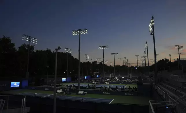 Shielded LED lights, approved by DarkSky International, illuminate the courts during the U.S. Open tennis tournament at the USTA Billie Jean King National Tennis Center in New York, on Monday, Aug. 18, 2025. (AP Photo/Mary Conlon)