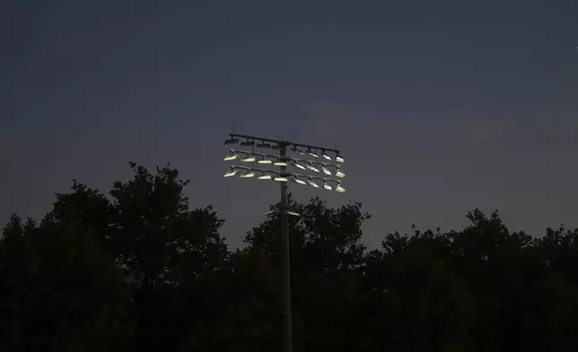 Shielded LED lights, approved by DarkSky International, illuminate a court during the U.S. Open tennis tournament at the USTA Billie Jean King National Tennis Center in New York, on Monday, Aug. 18, 2025. (AP Photo/Mary Conlon)