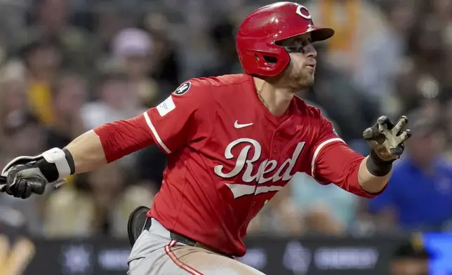 Cincinnati Reds' TJ Friedl watches his sacrifice fly during the seventh inning of a baseball game against the Pittsburgh Pirates, Saturday, Aug. 9, 2025, in Pittsburgh. (AP Photo/Matt Freed)