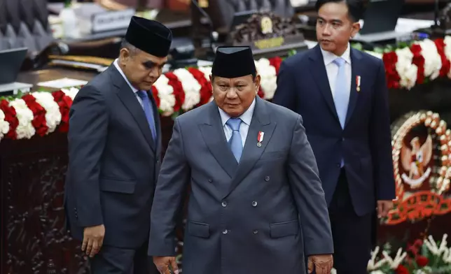 Indonesian President Prabowo Subianto leaves after delivering his annual State of the Nation Address ahead of the country's Independence Day, in Jakarta, Indonesia, Monday, Aug. 15, 2025. (Bay Ismoyo/Pool Photo via AP)