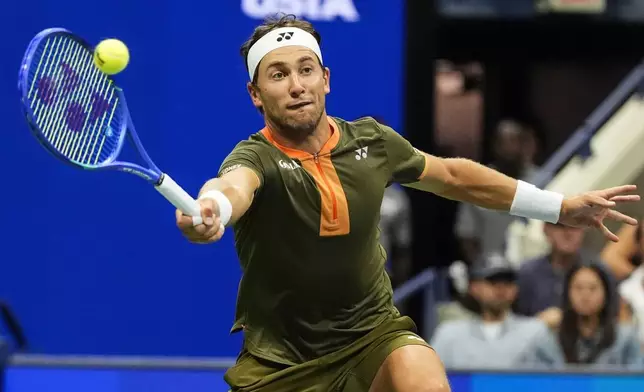 Casper Ruud, of Norway, returns a shot during the mixed doubles final at the U.S. Open tennis championships, Wednesday, Aug. 20, 2025, in New York. (AP Photo/Yuki Iwamura)
