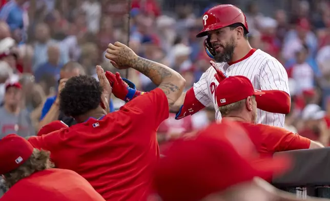 Philadelphia Phillies' Kyle Schwarber, right, celebrates his two-run home run with teammates during the third inning of a baseball game against the Baltimore Orioles, Monday, Aug. 4, 2025, in Philadelphia. (AP Photo/Chris Szagola)