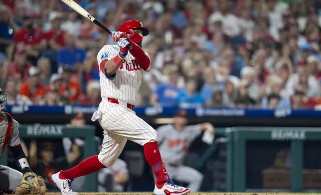 Philadelphia Phillies' Kyle Schwarber hits a grand slam home run during the sixth inning of a baseball game against the Baltimore Orioles, Monday, Aug. 4, 2025, in Philadelphia. (AP Photo/Chris Szagola)