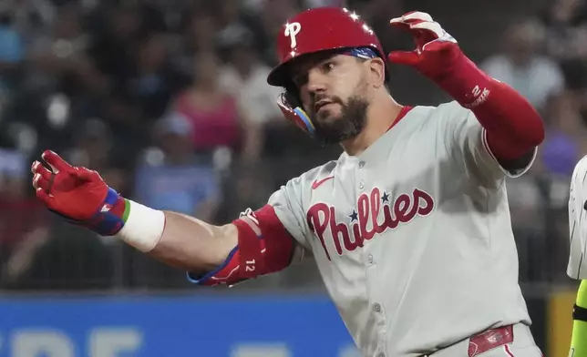 Philadelphia Phillies' Kyle Schwarber celebrates after hitting a double during the seventh inning of a baseball game against the Chicago White Sox in Chicago, Tuesday, July 29, 2025. (AP Photo/Nam Y. Huh)