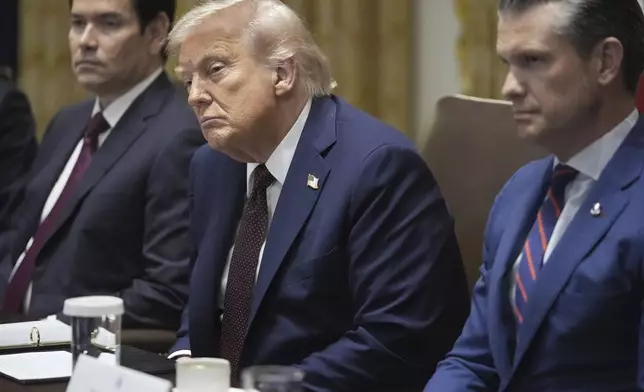 President Donald Trump, Secretary of State Marco Rubio, left, and Secretary of Defense Pete Hegseth, right, listen during a cabinet meeting. Tuesday, Aug. 26, 2025, at the White House in Washington. (AP Photo/Mark Schiefelbein)