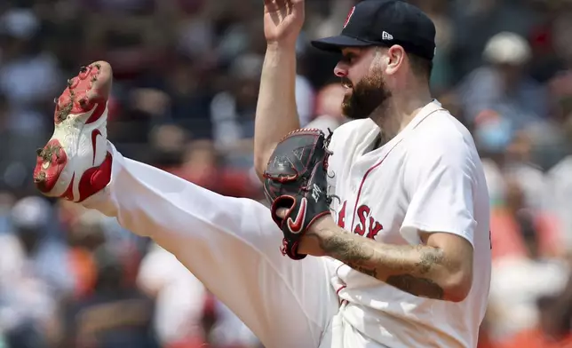 Boston Red Sox starting pitcher Lucas Giolito follows through on a pitch during a baseball game against the Houston Astros, Sunday, Aug. 3, 2025, in Boston (AP Photo/Jim Davis)
