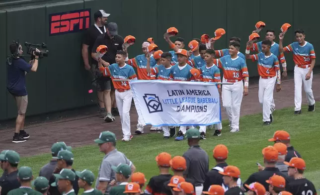 Venezuela's baseball team participates in the opening ceremony at the Little League World Series, Wednesday, Aug. 13, 2025, in South Williamsport, Pa. (AP Photo/Caleb Craig)