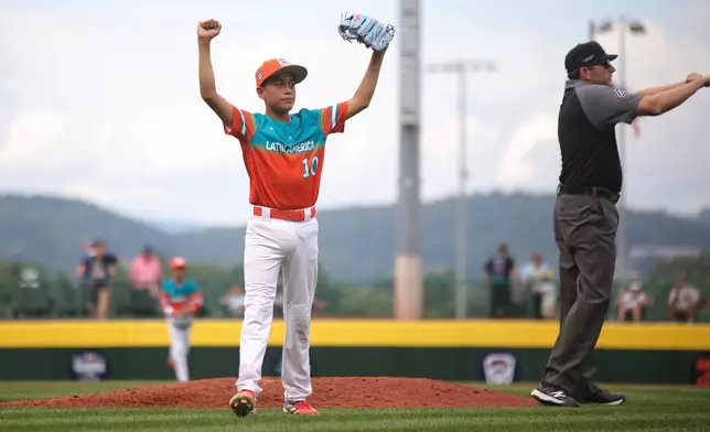 Venezuela's Juan Reyes celebrates a win against Puerto Rico following a baseball game at the Little League World Series Wednesday, Aug. 13, 2025, in South Williamsport, Pa. (AP Photo/Jared Freed)