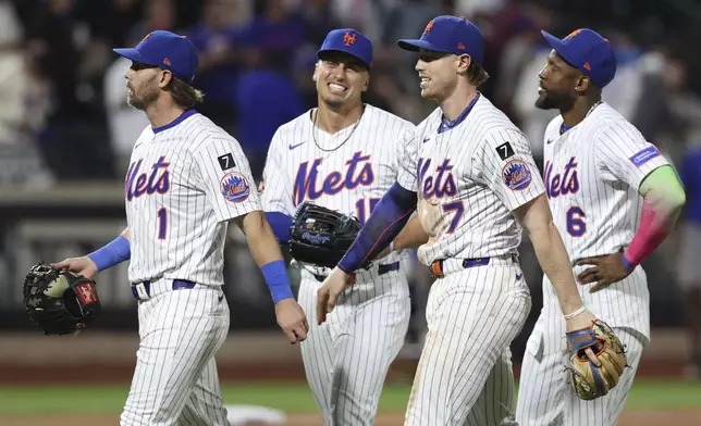 From left, New York Mets' Jeff McNeil, Tyrone Taylor, Brett Baty and Starling Marte react after defeating the Philadelphia Phillies during a baseball game, Wednesday, Aug. 27, 2025, in New York. (AP Photo/Pamela Smith)
