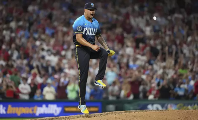 Philadelphia Phillies pitcher Jhoan Duran reacts after the Phillies won a baseball game against the Atlanta Braves Friday, Aug. 29, 2025, in Philadelphia. (AP Photo/Matt Slocum)