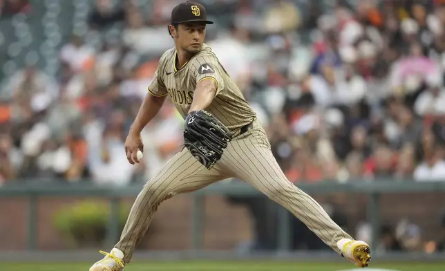 San Diego Padres pitcher Yu Darvish throws against the San Francisco Giants during the first inning of a baseball game in San Francisco, Monday, Aug. 11, 2025. (AP Photo/Jeff Chiu)