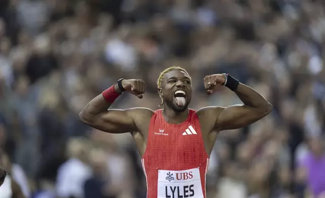 Noah Lyles, of United States, celebrates winning the men's 200-meter race at the World Athletics Diamond League final 2025 athletics meeting in Zurich, Switzerland, Thursday, Aug. 28, 2025. (Til Buergy/Keystone via AP)