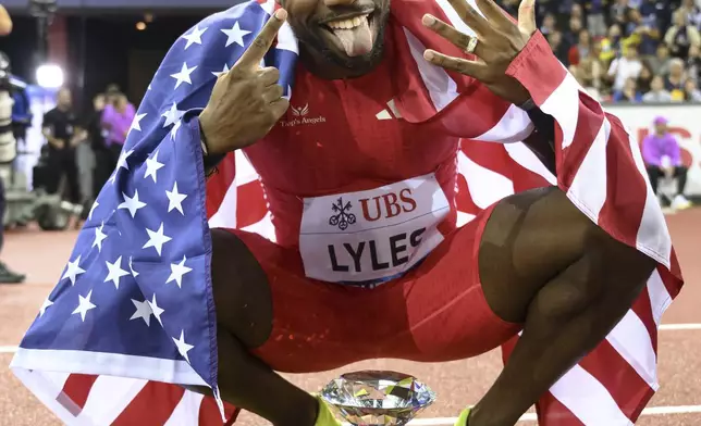 Noah Lyles of the US celebrates winning the men's 200m competition during the World Athletics Diamond League final 2025 athletics meeting in Zurich, Switzerland, Thursday, Aug. 28, 2025. (Ennio Leanza/Keystone via AP)