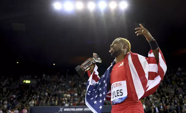 Noah Lyles of the US celebrates winning the men's 200m competition during the World Athletics Diamond League final 2025 athletics meeting in Zurich, Switzerland, Thursday, Aug. 28, 2025. (Ennio Leanza/Keystone via AP)