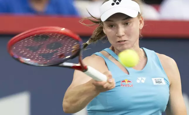 Elena Rybakina, of Kazakhstan, hits a return to Victoria Mboko, of Canada, during their semifinal match at the National Bank Open tennis tournament in Montreal, Wednesday, Aug. 6, 2025. (Christinne Muschi/The Canadian Press via AP)