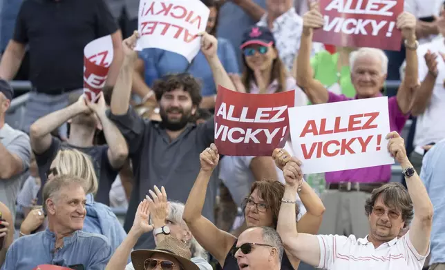 Fans cheer as Victoria Mboko, of Canada, plays against Elena Rybakina, of Kazakhstan, during their semifinal match at the National Bank Open tennis tournament in Montreal, Wednesday, Aug. 6, 2025. (Christinne Muschi/The Canadian Press via AP)