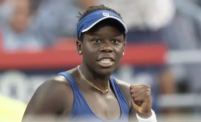 Victoria Mboko of Canada reacts during her game against Elena Rybakina of Kazakhstan during semifinal tennis action at the National Bank Open in Montreal, Wednesday, Aug. 6, 2025. (Christinne Muschi/The Canadian Press via AP)