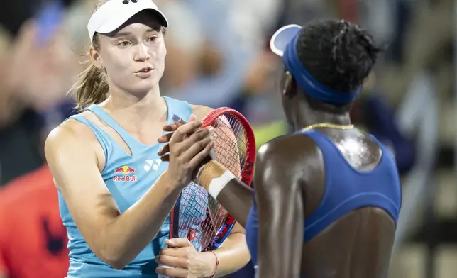 Elena Rybakina of Kazakhstan, left, congratulates Victoria Mboko of Canada on her win during semifinal tennis action at the National Bank Open in Montreal, Wednesday, Aug. 6, 2025. (Christinne Muschi/The Canadian Press via AP)
