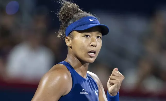 Naomi Osaka, of Japan, reacts against Clara Tauson, of Denmark, during their semifinal match at the National Bank Open tennis tournament in Montreal, Wednesday, Aug. 6, 2025. (Christinne Muschi/The Canadian Press via AP)