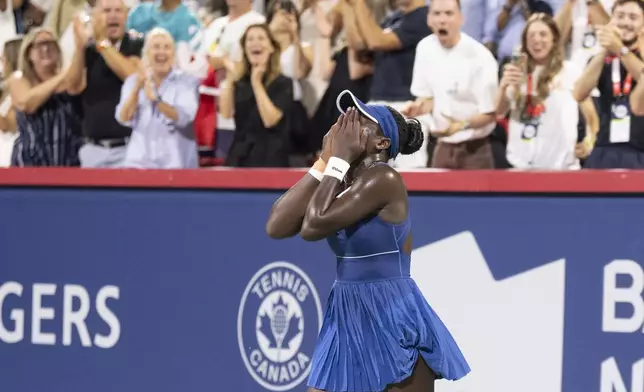Victoria Mboko of Canada reacts following her win over Elena Rybakina of Kazakhstan during semifinal tennis action at the National Bank Open in Montreal, Wednesday, Aug. 6, 2025. (Christinne Muschi/The Canadian Press via AP)